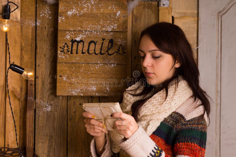 Woman examining letters from the mail box