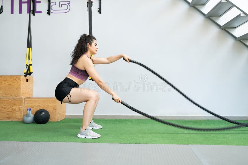 Woman Exercising with Battle Ropes at Gym Stock Photo - Image of strength,  health: 189950848