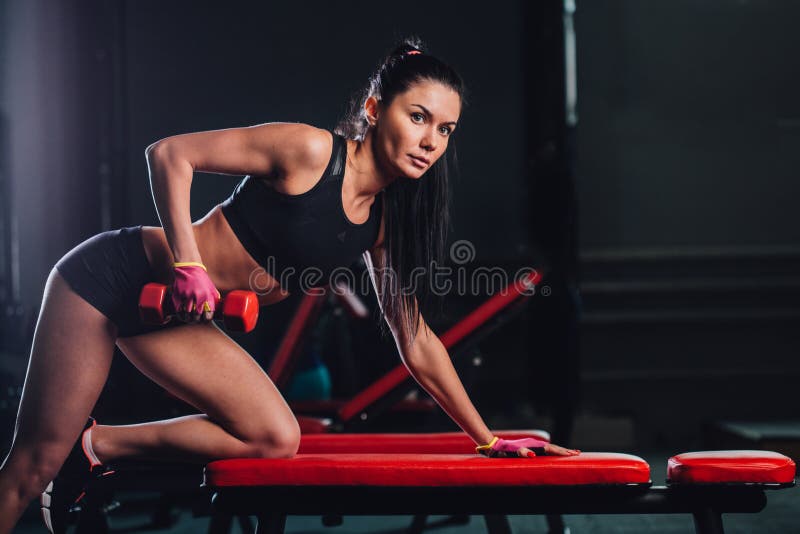 Woman Exercising Dumbbell Row At The Gym Stock Image Image Of Muscular Person 69874487