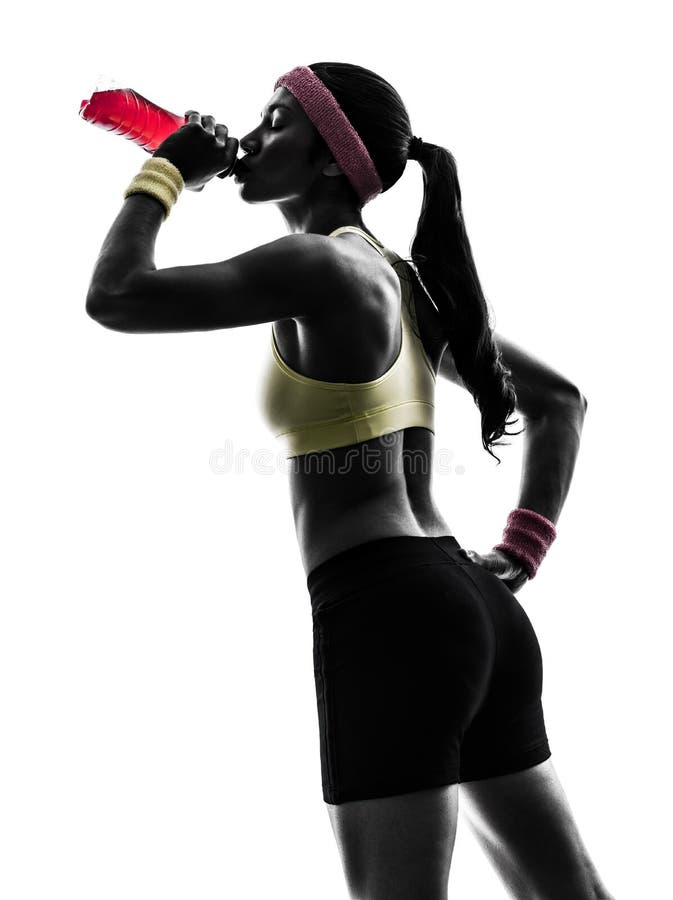 Woman exercising fitness drinking energy drink silhouette
