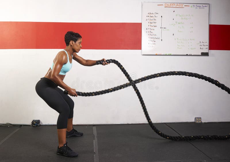 Woman Exercising With Ropes