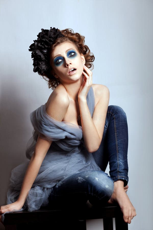 Woman face bright blue makeup. Fantasy, glamour