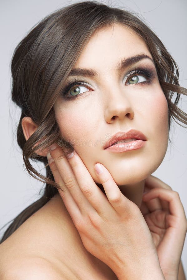 Woman face close up beauty portrait. Girl with long hair lookin