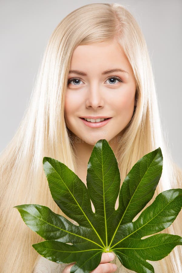 Woman Face Hair Treatment, Fresh Exotic Palm Leaf, Young Smiling Model Beauty Portrait Natural Makeup