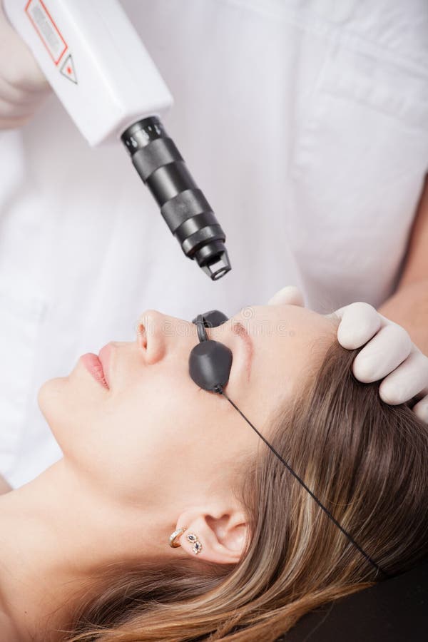 Woman during Face Laser Therapy in Cosmetics Stock Photo Image of