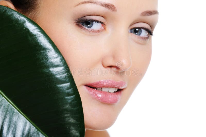 Woman face with a leaf cover her beauty face royalty free stock photos Woman face with a leaf cover her beauty face royalty free stock photos