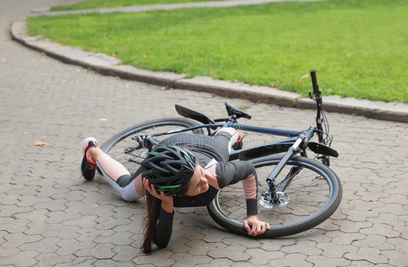 Young Woman Fallen Off Her Bicycle in Park Stock Photo Image of bike