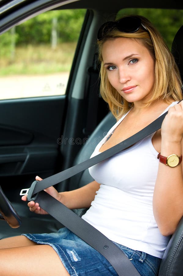 Woman Fastens A Seat Belt In Car Stock Image Image 21729041