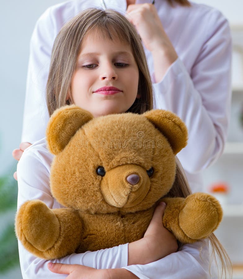 Woman Female Doctor Examining Little Cute Girl with Toy Bear Stock ...
