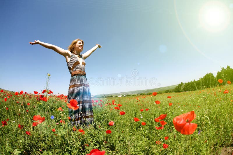 Woman in a field of poppies