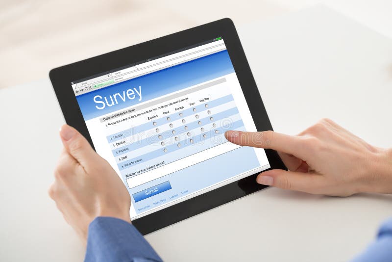 Woman Filling Online Survey Form On Digital Tablet