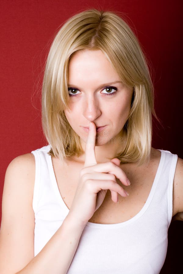 Woman with finger on lips