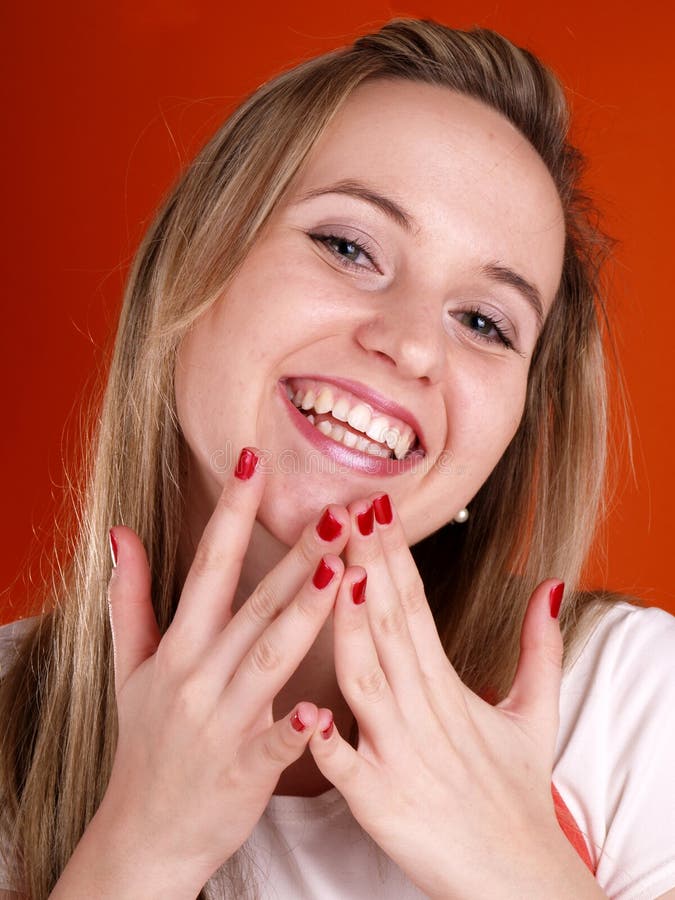 Woman with fingers over her face