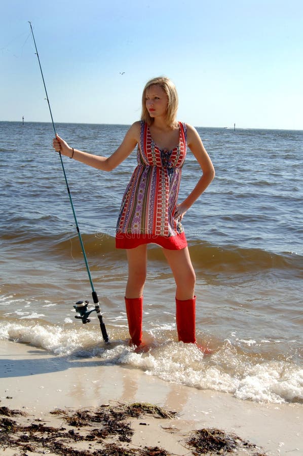 Woman fishing portrait stock photo