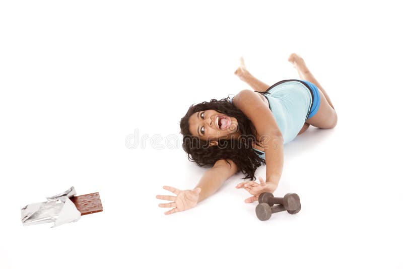 Woman fitness reach for chocolate