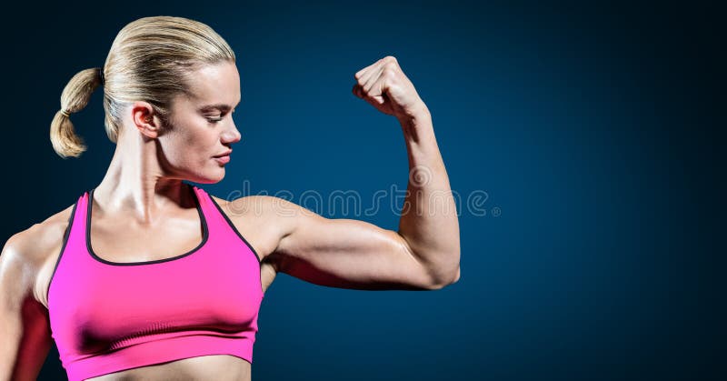 Woman flexing her biceps, Stock Photo, Picture And Royalty Free