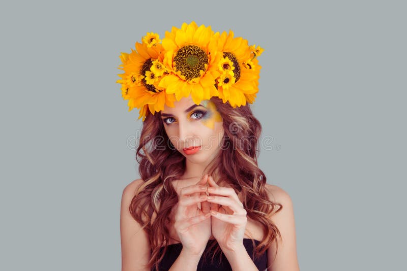 Woman with floral headband plotting something royalty free stock photography Woman with floral headband plotting something royalty free stock photography