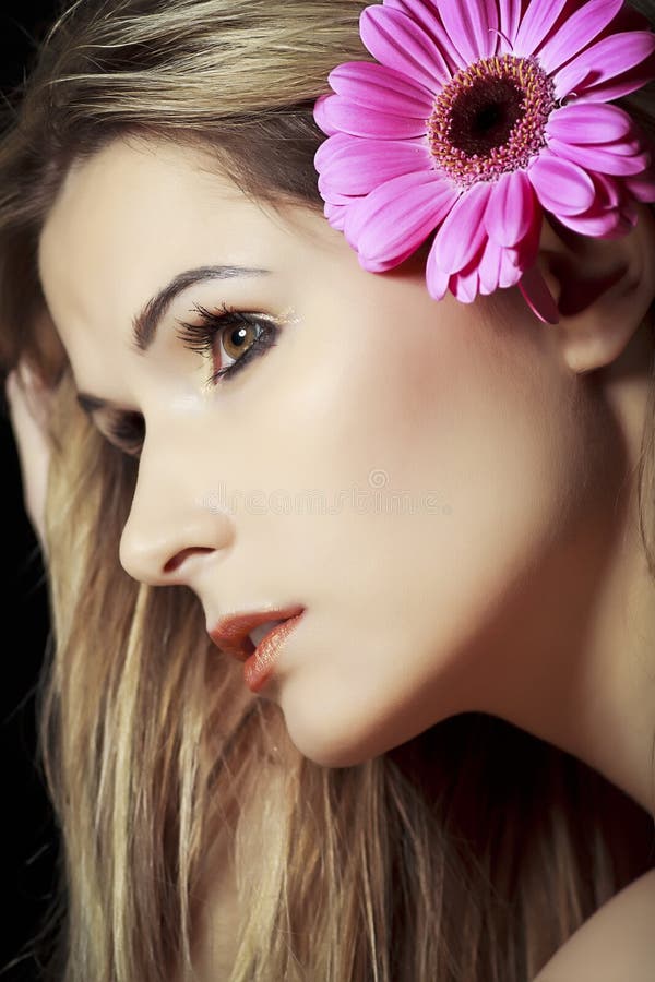 Woman with flower in hair stock photo. Image of beautiful - 23517388