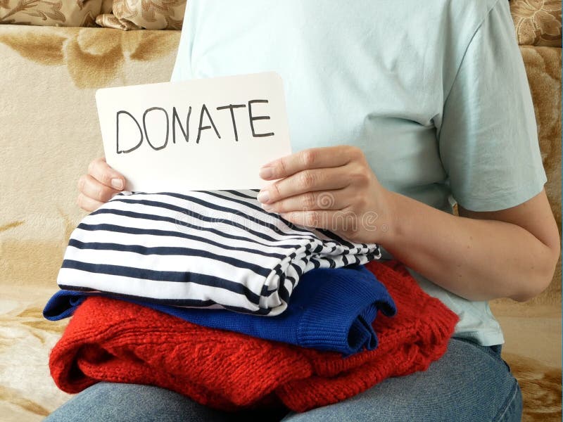 Woman Fold Clothes Washed Laundry and Clothes, Clothes for Donation