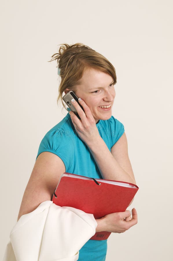 Woman with folder and mobile royalty free stock photos Woman with folder and mobile royalty free stock photos