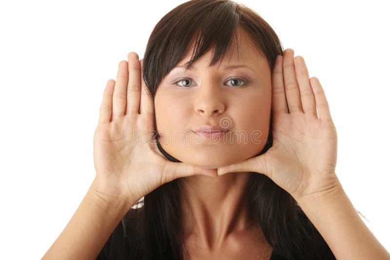 Woman, framing her face with her hands royalty free stock photos Woman, framing her face with her hands royalty free stock photos