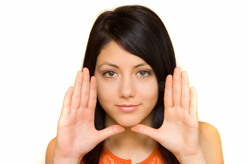 Woman framing her face with her palms