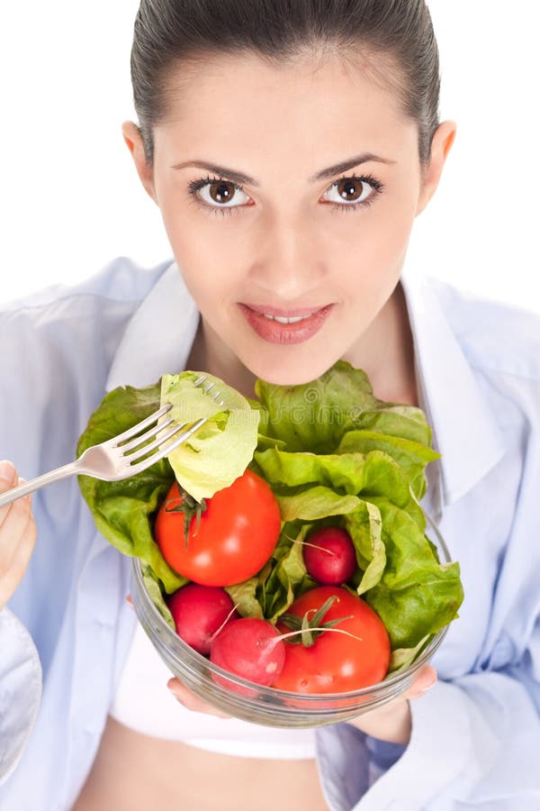 Close-up, fresh vegetable salad with a pretty woman holding, isolated on background. Close-up, fresh vegetable salad with a pretty woman holding, isolated on background