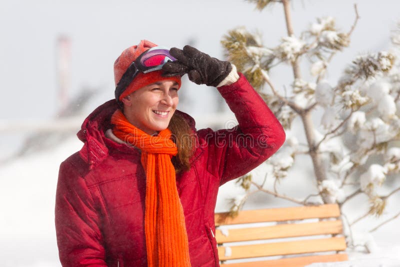 Woman in front of ski hut