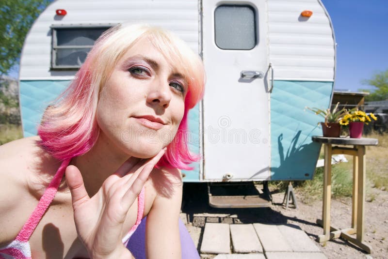 Woman in front of Travel Trailer