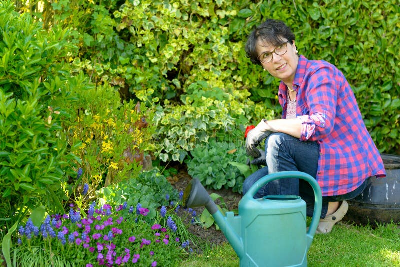 Woman Gardening in Her Beautiful Garden. Stock Photo - Image of ...