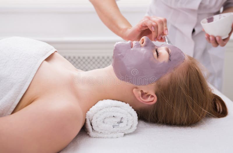 Woman gets face mask by beautician at spa royalty free stock image Woman gets face mask by beautician at spa royalty free stock image