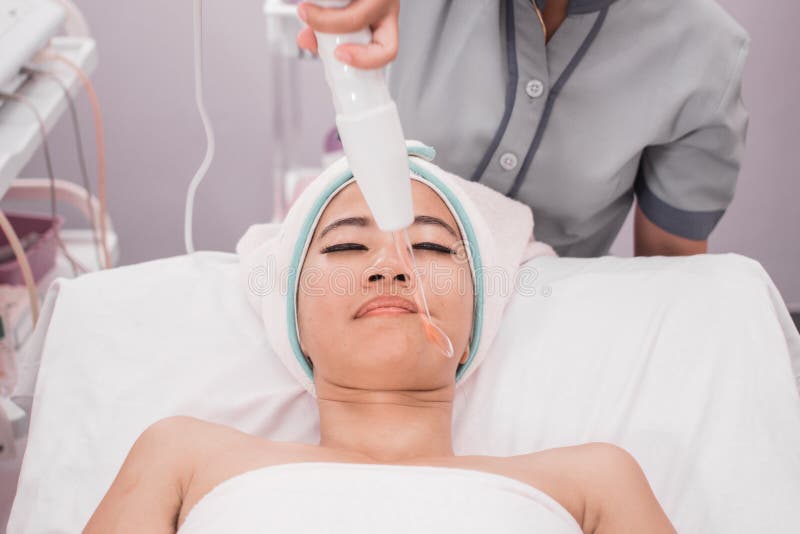Woman getting facial darsonval therapy royalty free stock images Woman getting facial darsonval therapy royalty free stock images