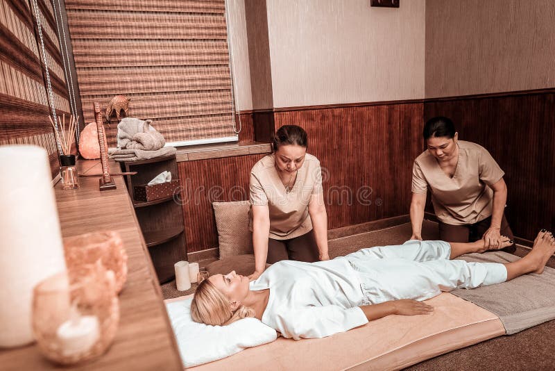 Woman Getting Fourhand Massage In Thai Massage Salon Stock Image