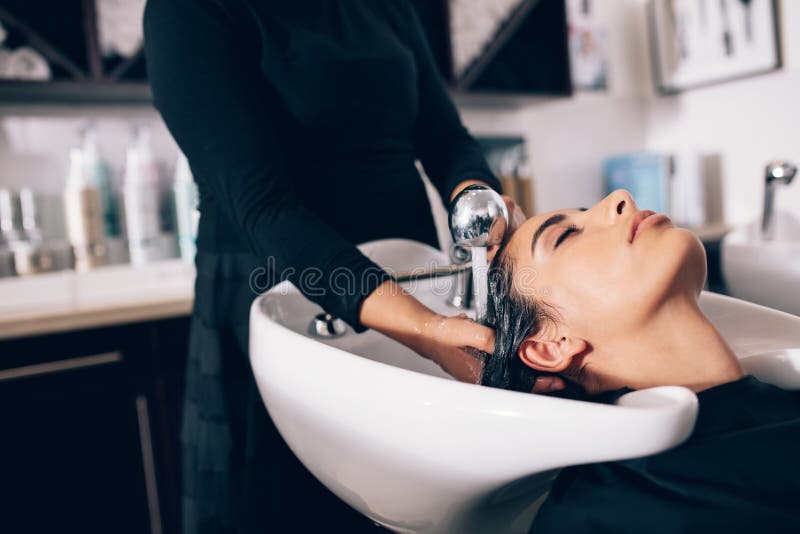 Woman Getting Hair Wash Done at Salon Stock Photo - Image of working,  service: 98383650