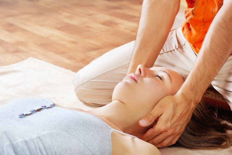 Woman getting neck massage royalty free stock photography