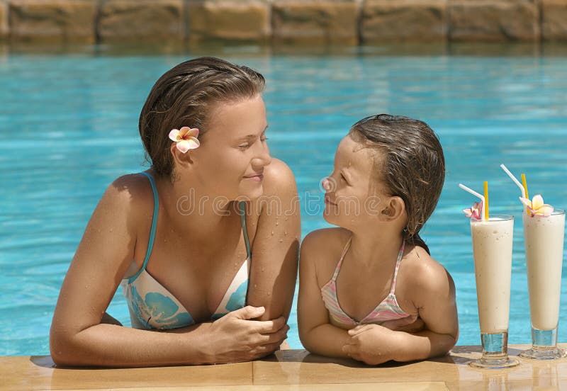 Woman and girl in the swimming pool