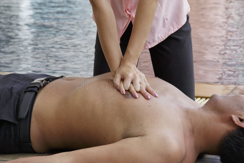Woman giving CPR to drowning man, CPR life saving royalty free stock images Woman giving CPR to drowning man, CPR life saving royalty free stock images