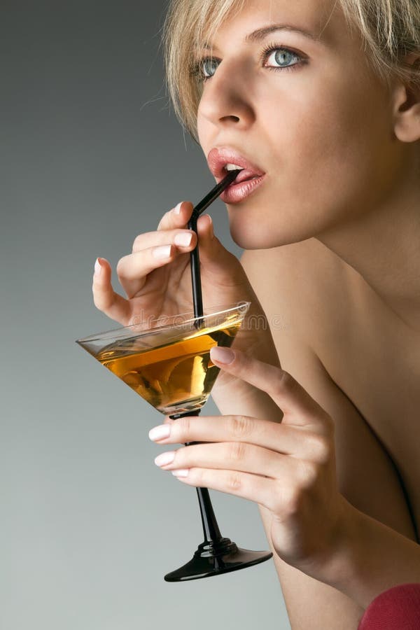 Woman with glass of cocktail