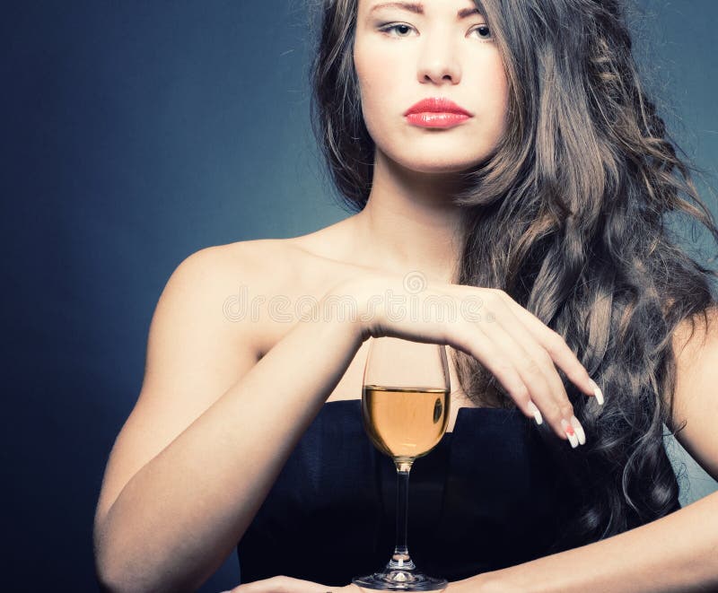 woman with a glass of white wine