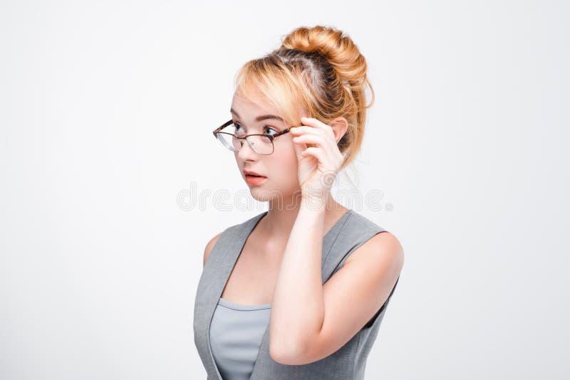 Woman in glasses looks distrustful and doubtful royalty free stock photo Woman in glasses looks distrustful and doubtful royalty free stock photo