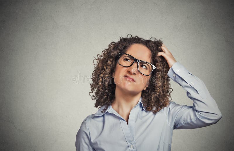 Woman with glasses scratching head, thinking confused