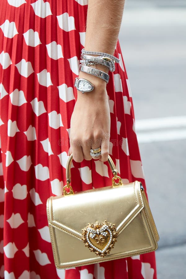 Woman with Golden Dolce and Gabbana Bag and Bulgari Watch before Sportmax  Fashion Show, Milan Editorial Photography - Image of ring, milan: 194221427