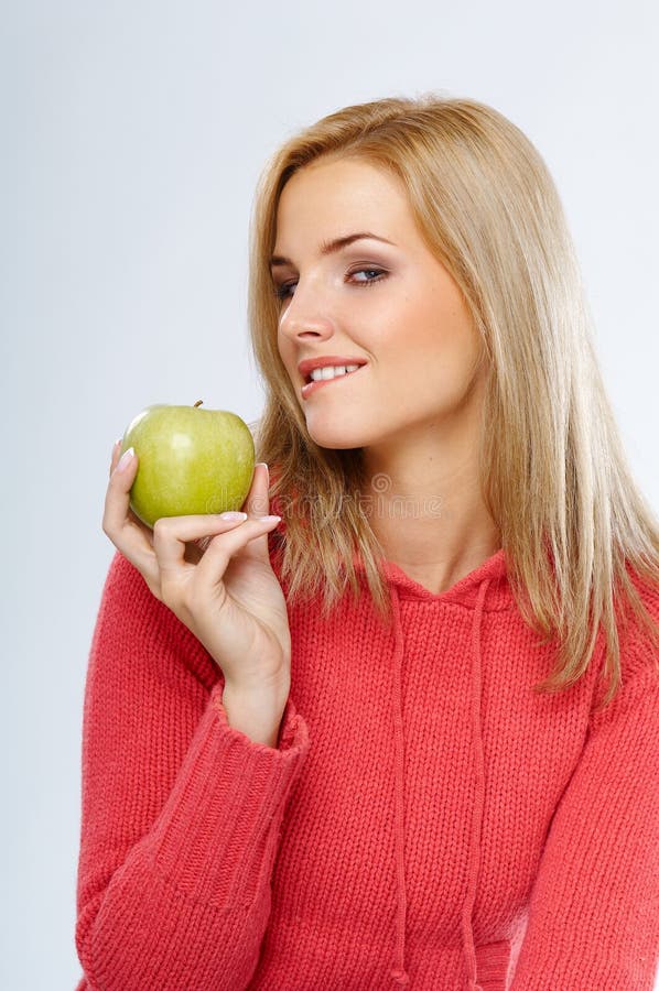 Woman with green apple stock photos Woman with green apple stock photos