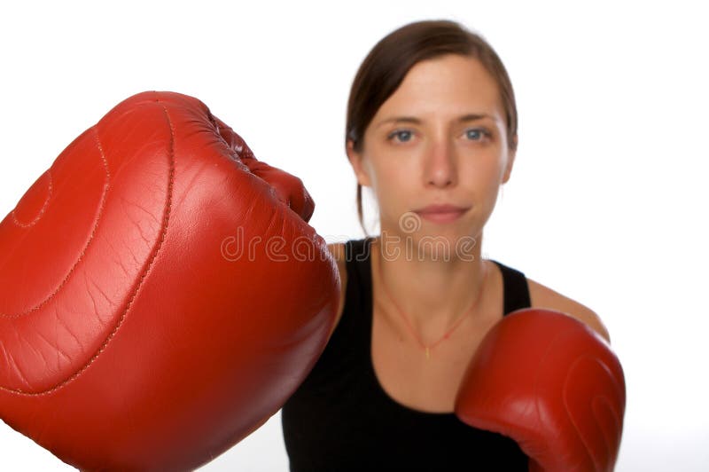 Woman in gym clothes, with boxing gloves, strength