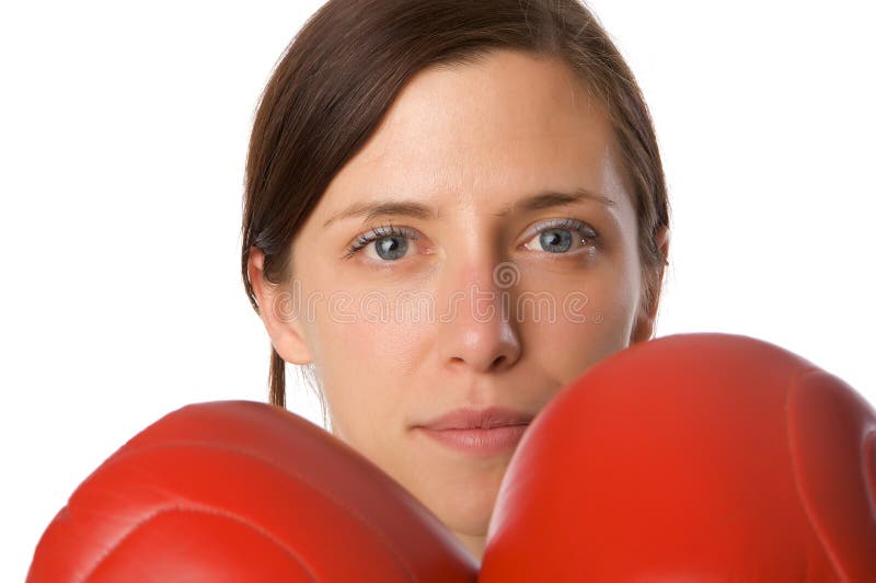 Woman in gym clothes, with boxing gloves, strength