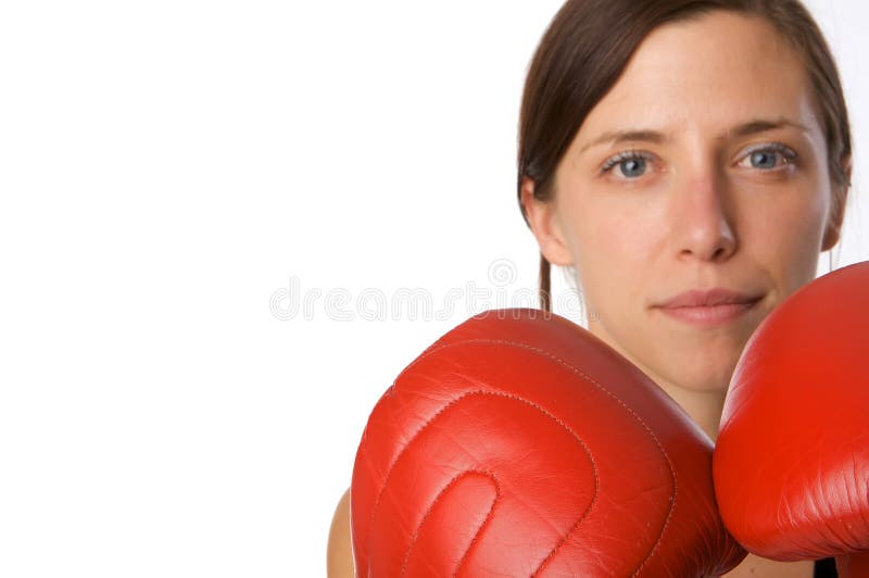 Woman in gym clothes, with boxing gloves, strength