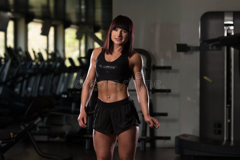 Woman In Gym Showing Her Well Trained Body.