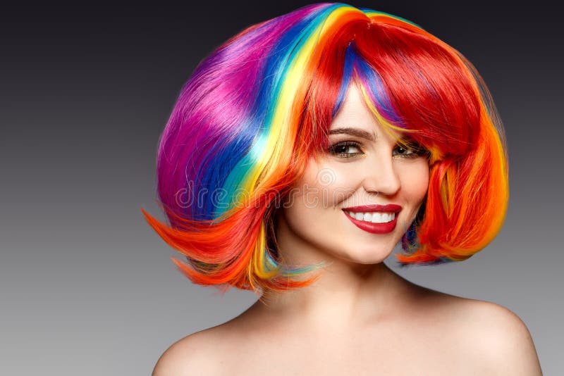 Woman hair as color splash. Rainbow up do short haircut. Beautiful young girl model with glowing healthy skin. royalty free stock photos Woman hair as color splash. Rainbow up do short haircut. Beautiful young girl model with glowing healthy skin. royalty free stock photos