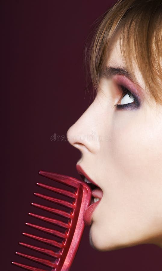 Closeup of woman with hairbrush