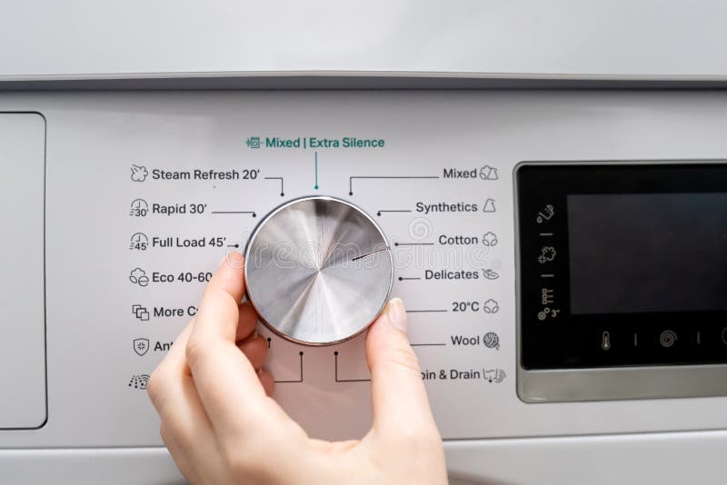 Woman Hand Choosing Program on Automatic Washing Machine for daily